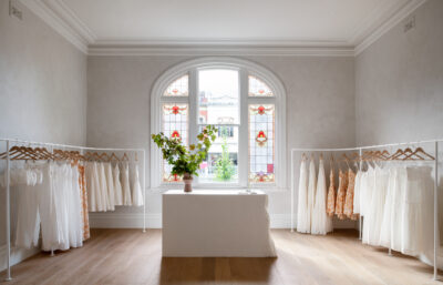 A boutique interior featuring stained-glass windows, minimalist fittings, and natural textures.