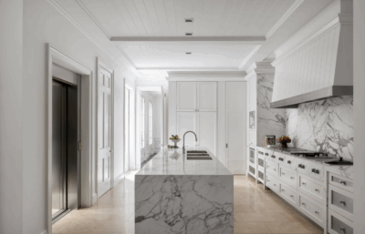 Luxury Brisbane kitchen with marble island and bespoke white joinery by The Stylesmiths interior designers