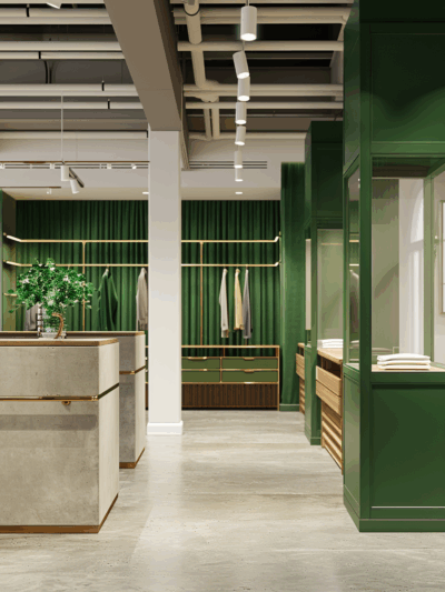 A luxury retail interior in Sydney by The Stylesmiths, blending deep green hues, brass accents and contemporary architectural detailing.